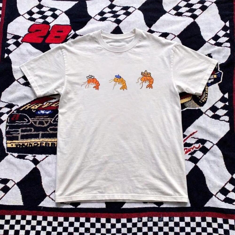 White Graphic Tee With Orange Shrimp Design Made From Cotton